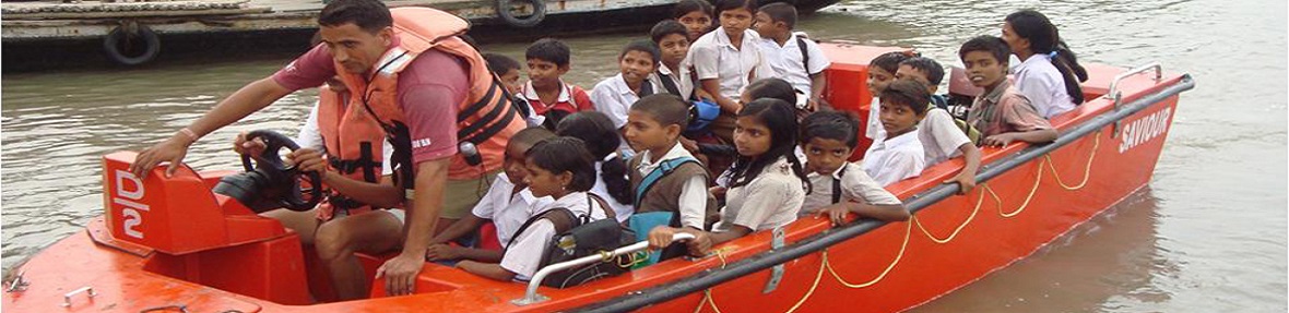 National Disaster Response Force(NDRF) shifting school children to safer places during Cyclone Aila.